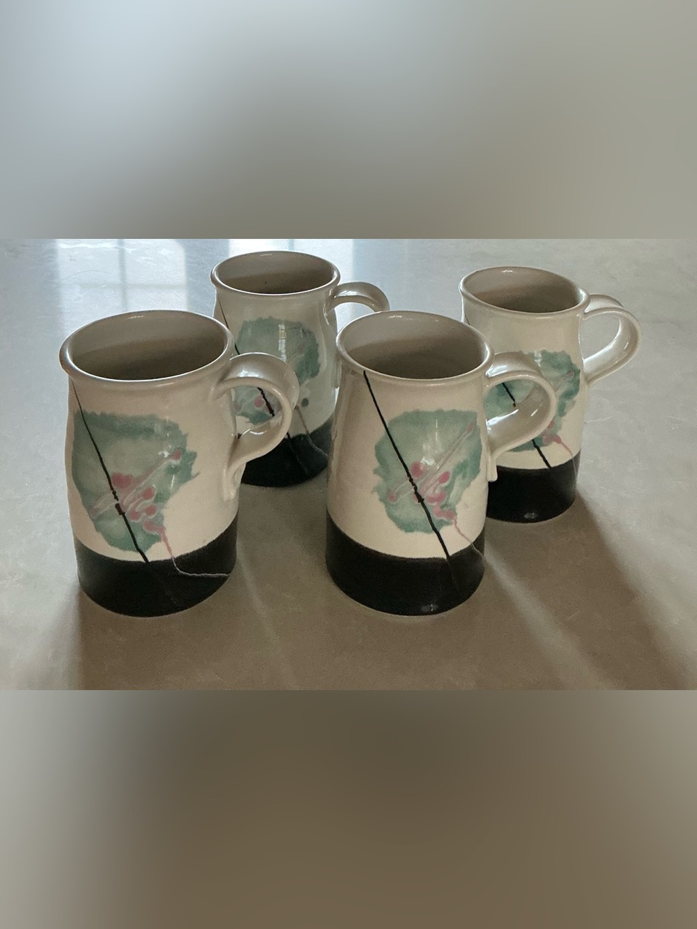Handcrafted Ceramic Mugs with Green Floral Accent